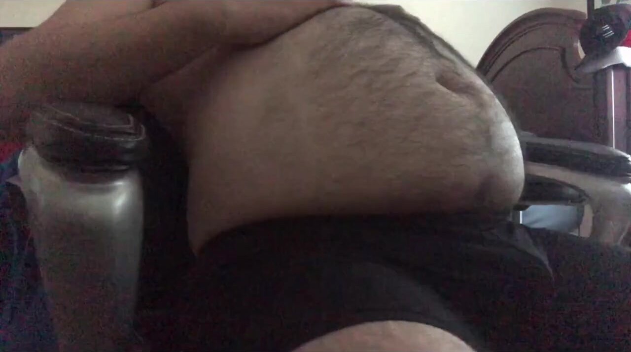 Mikey C playing with his huge hairy belly