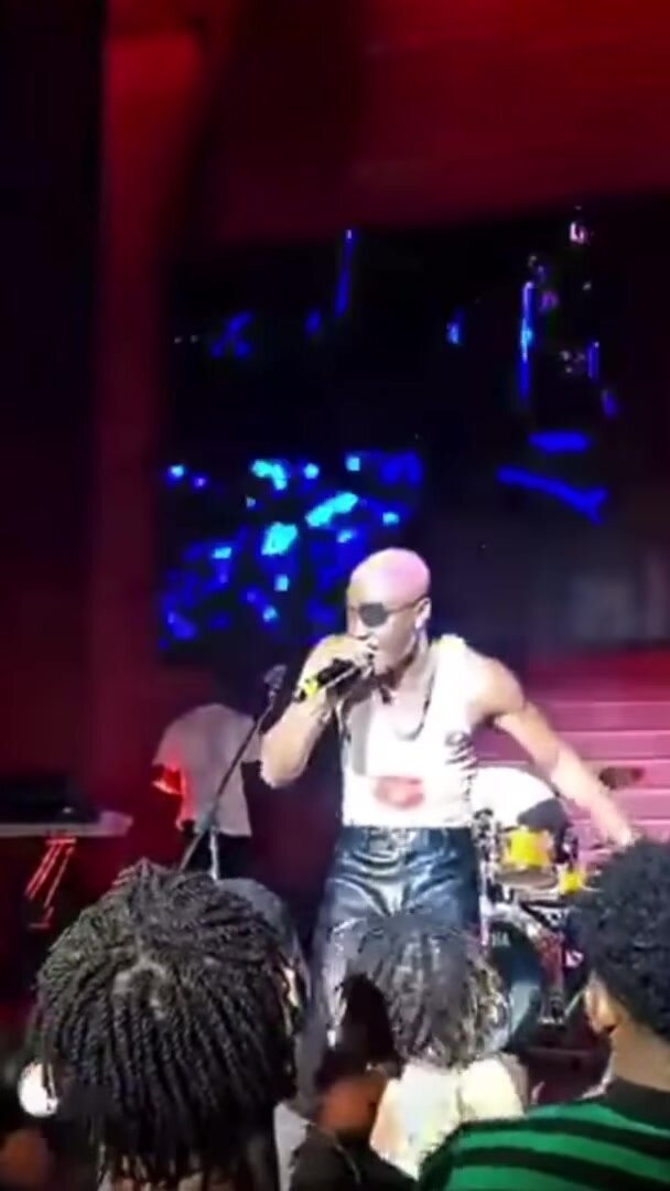 Woman grabs Male singer's hammer mid performance