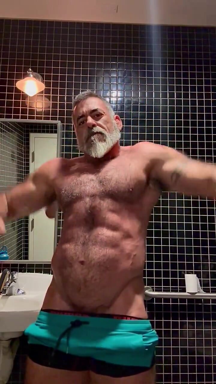 Hairy daddy flexing his body