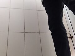 5 men pissing in squat toilet.