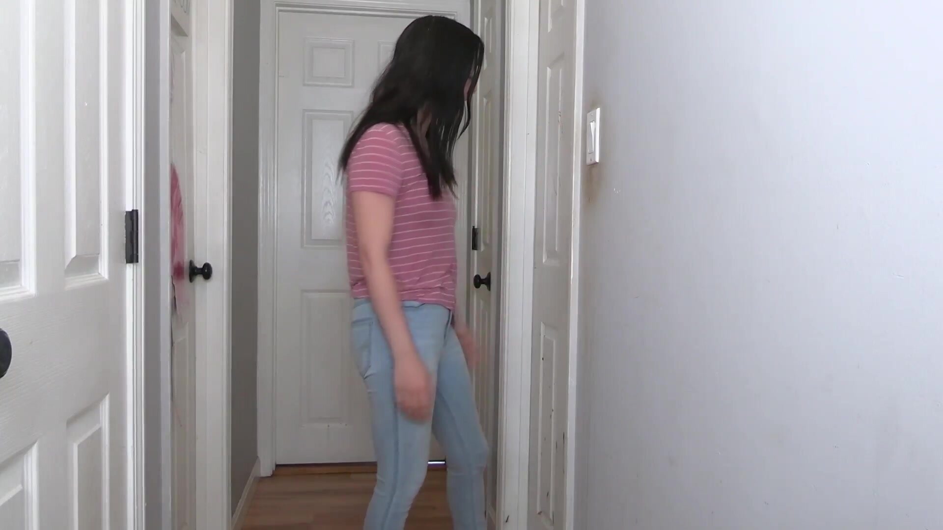 Woman struggles with stuck bathroom door, pees