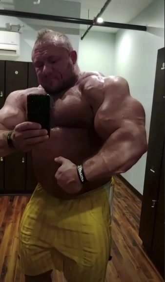 Huge bodybuilder showing off