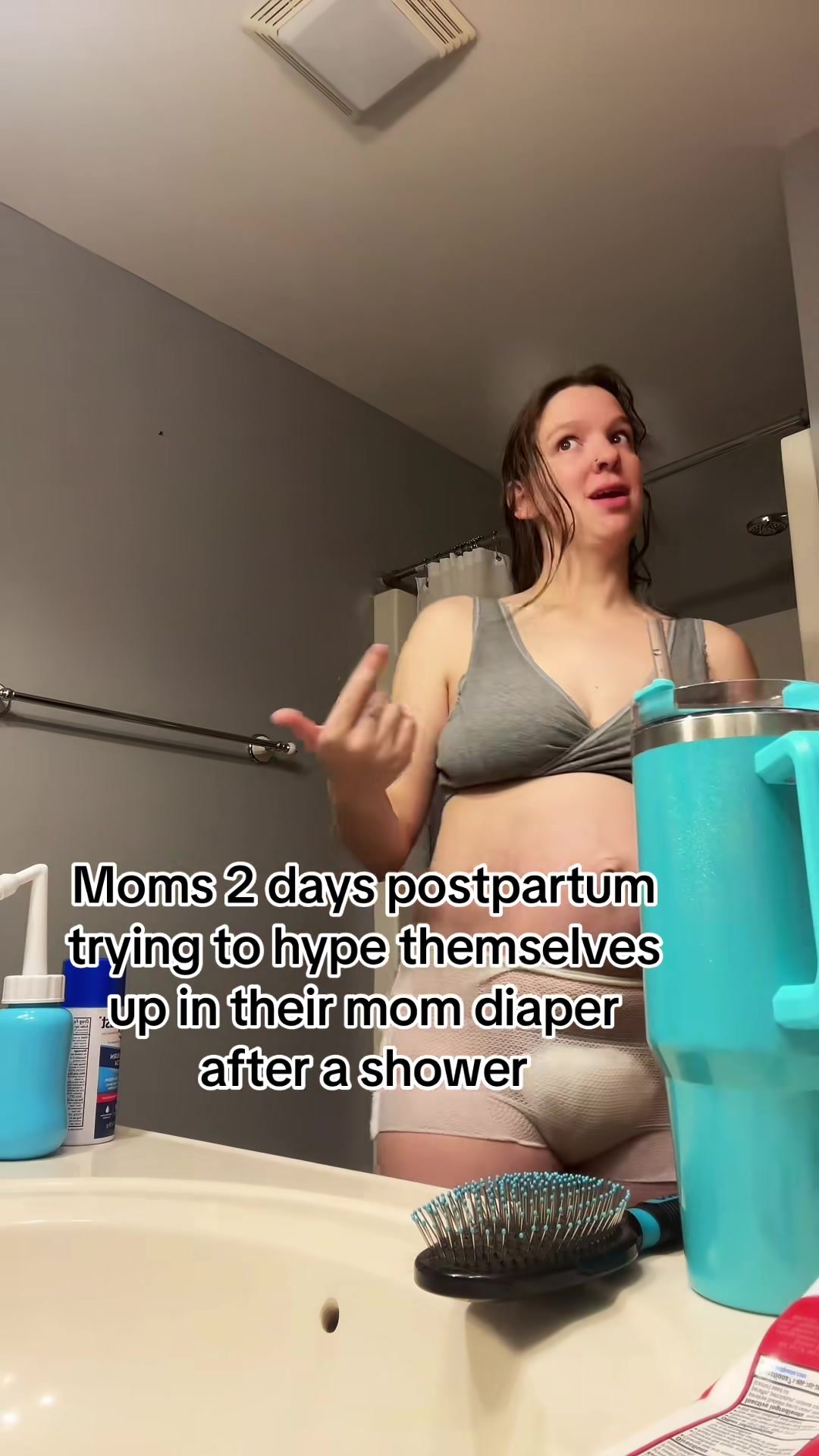 Cute mom in postpartum diaper