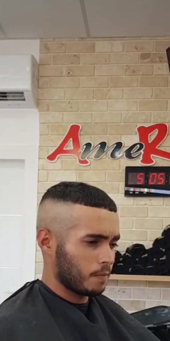 Sexy barber shaves sides