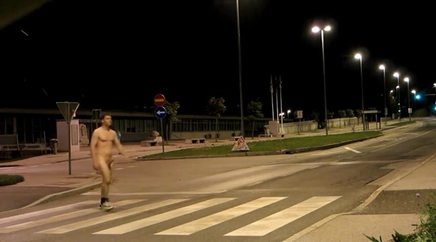 Naked man walking on pedestrian crossing
