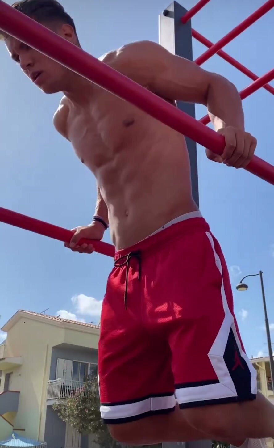 Italian sexy young muscle man doing workout in public