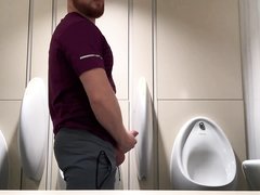 Ginger guy jerking off at the urinals