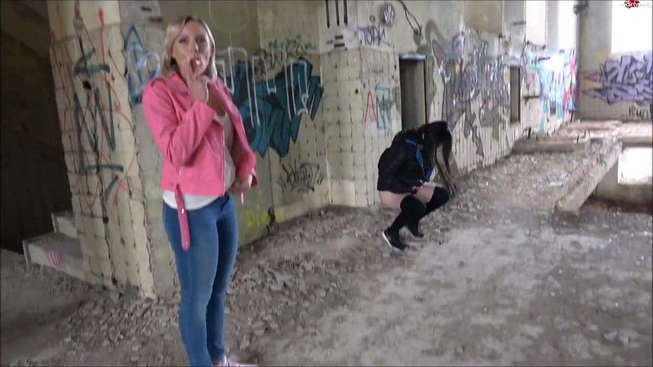 three girls peeing in abandoned building