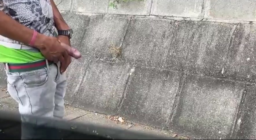 Jamaican man showing off pissing