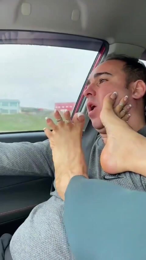 Feet worshipping in car