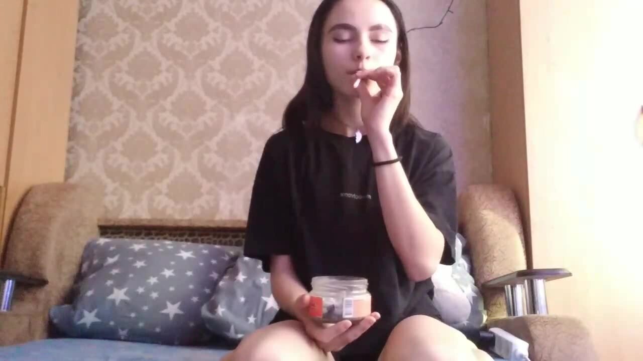 young Russian girl spitting in jar