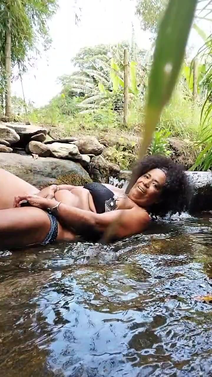 Cute big ass Portuguese woman washes in river water (2)