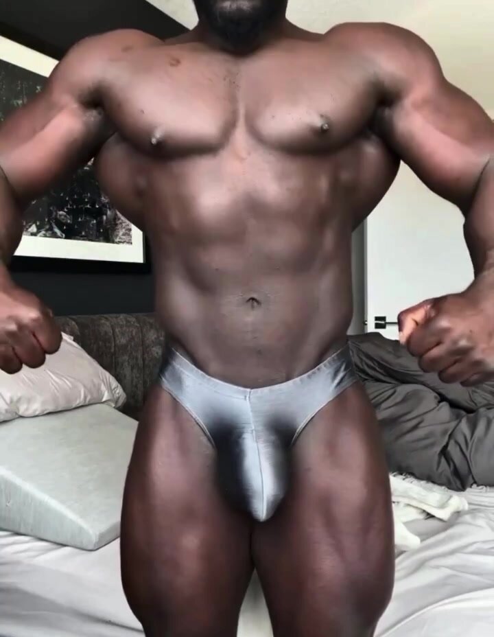 Bodybuilder with huge bulge posing