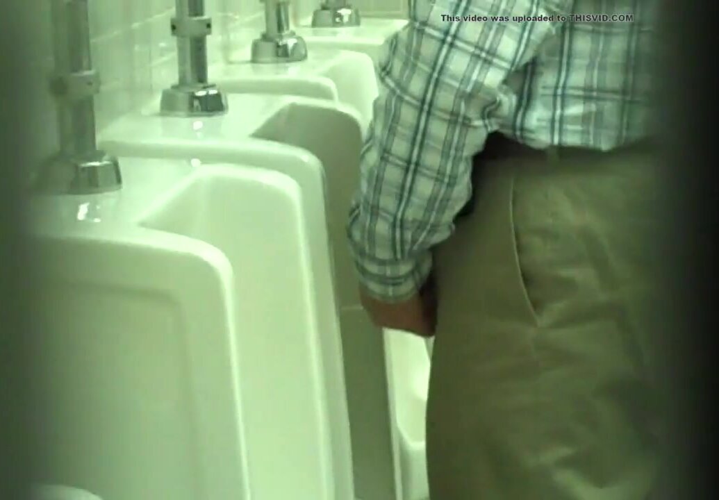 Middle-aged man whizzing in urinal WTF