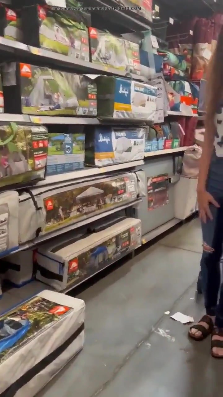 hot girl pissing in her jeans in store