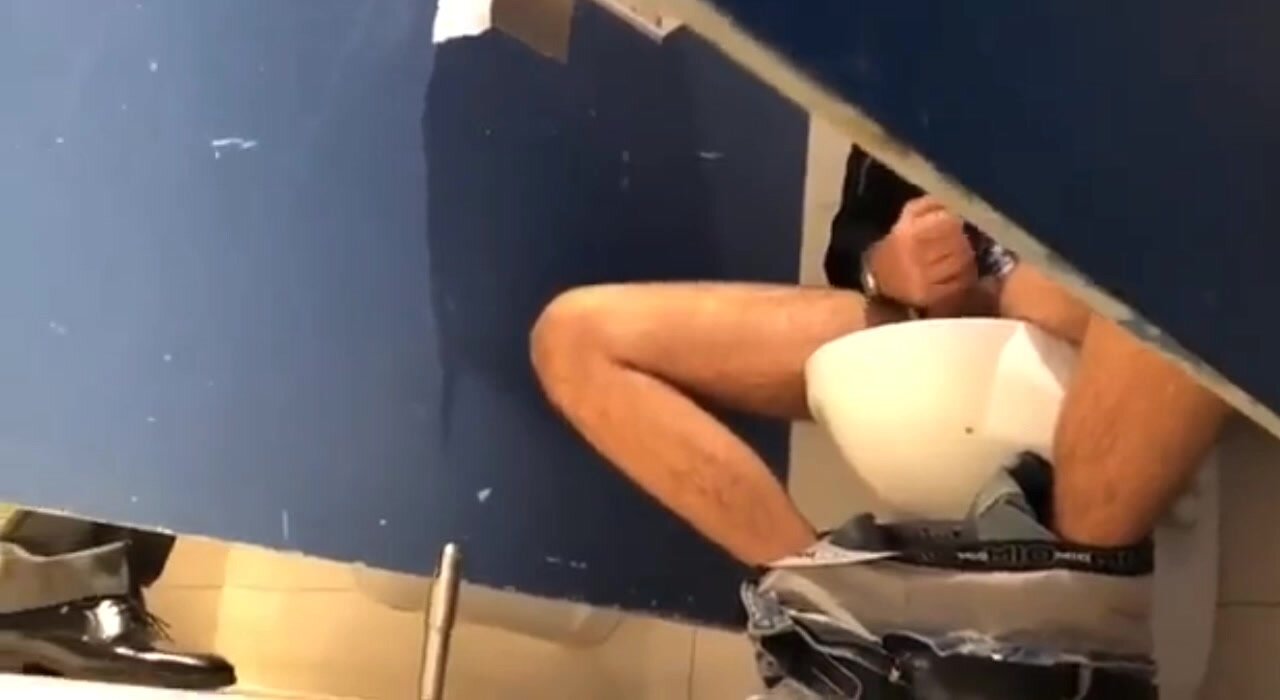 Mature masturbates in public bathroom