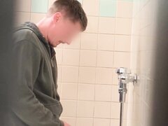 Sexy guy caught taking a leak