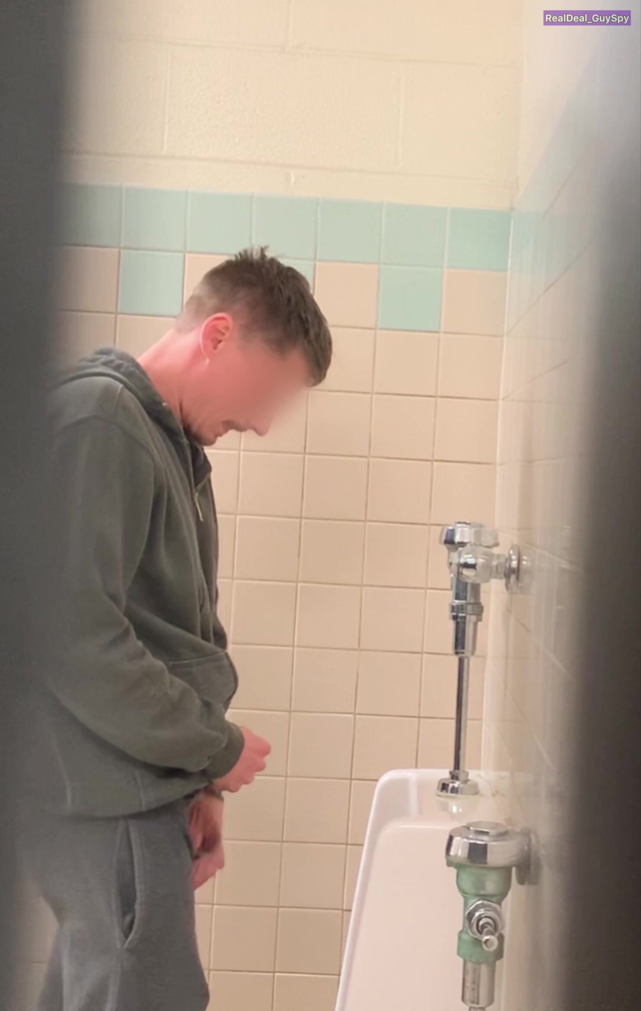 Sexy guy caught taking a leak