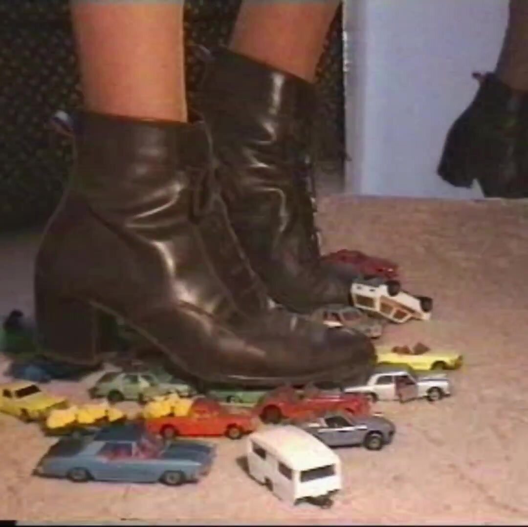 Lady punishes Matchbox diecast cars under boots