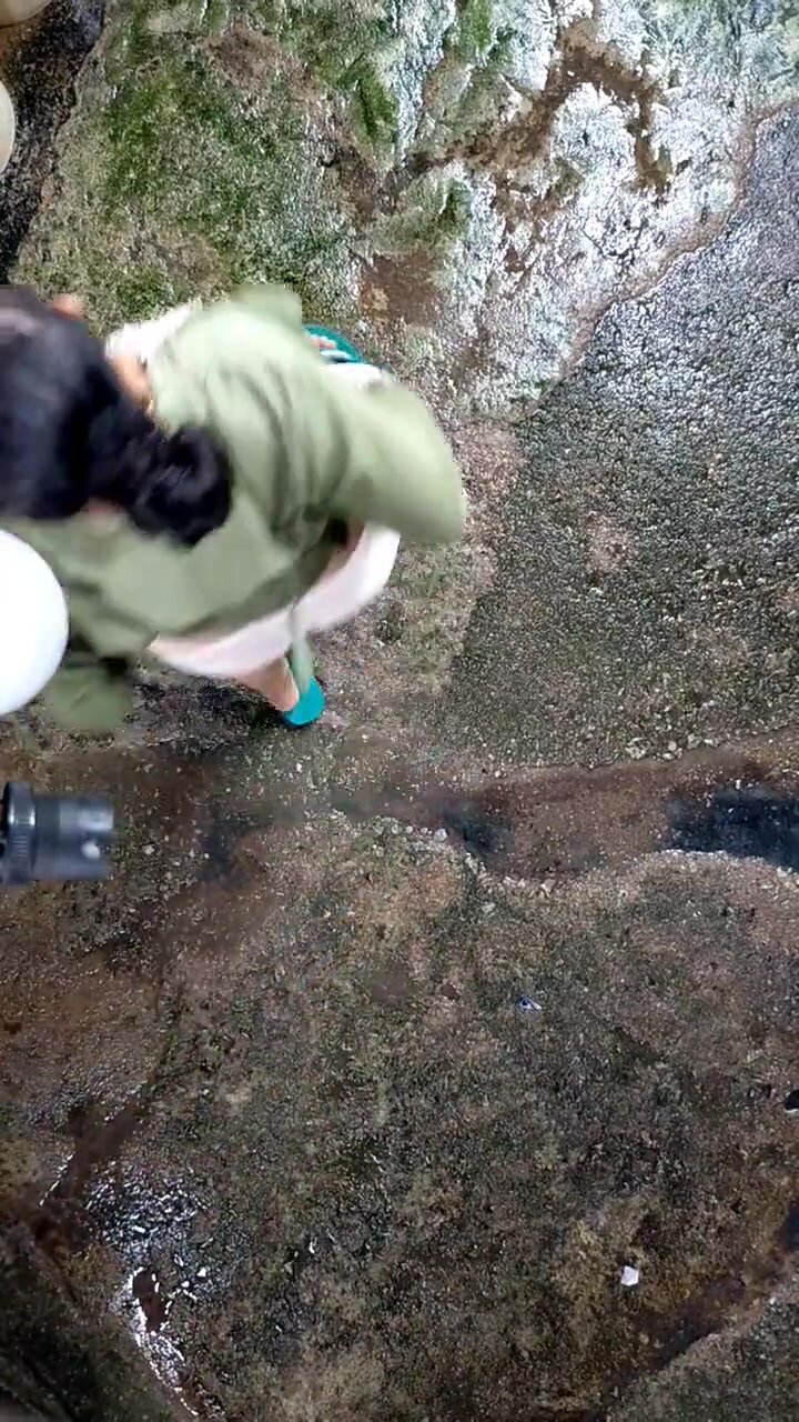 Kampung Bahru Johor, Malaysia woman water washes vagina