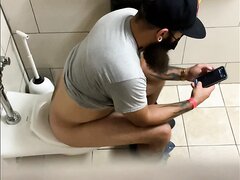 Spying on a tattooed Latino with a huge cock