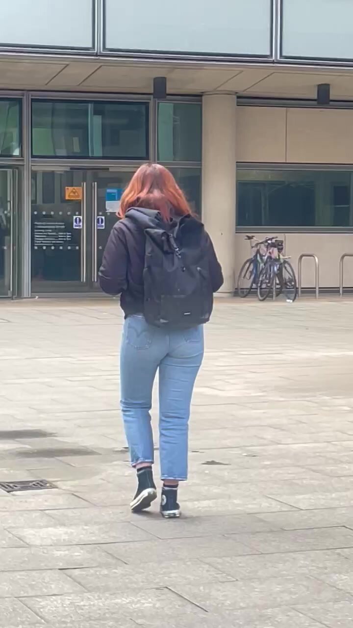 Redhead walking in jeans