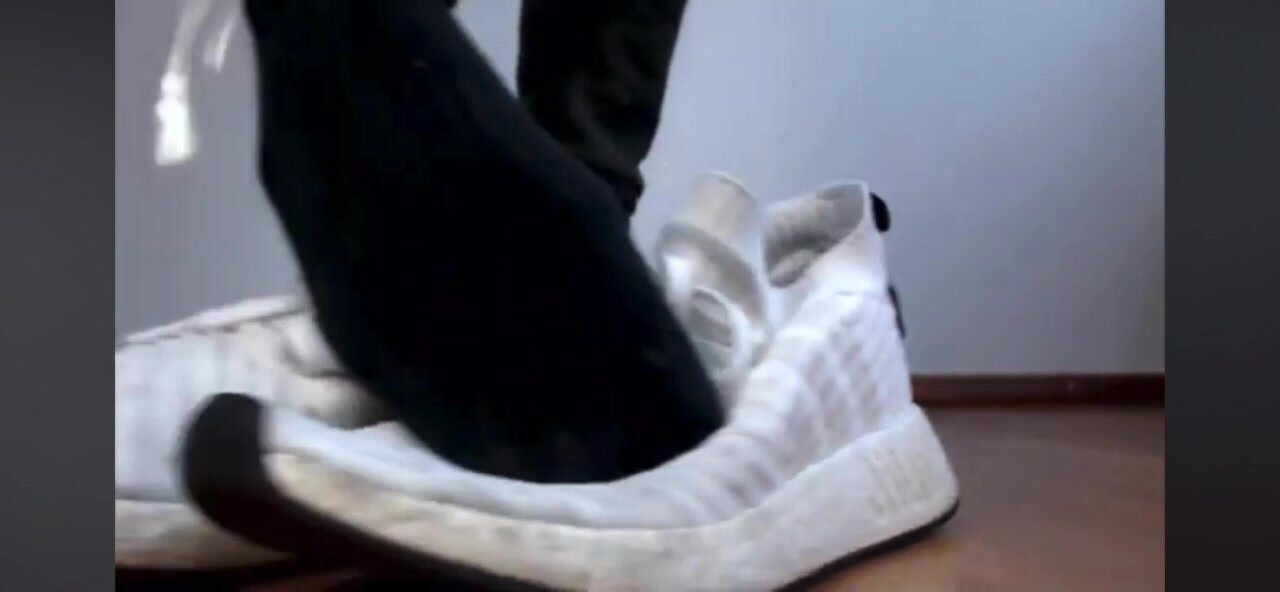 Teen boy shows sweaty socks from adidas shoes