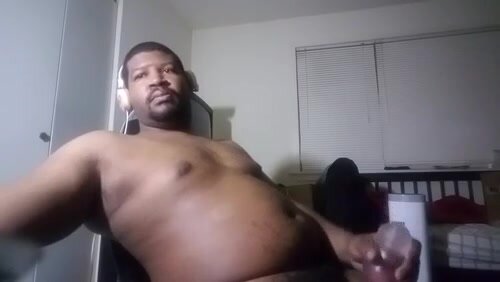 Black man with belly jacking with toys
