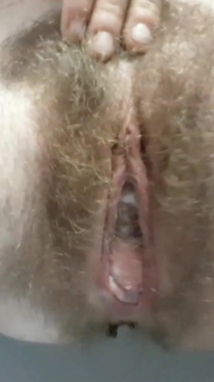 Hairy girl pooping on the toilet