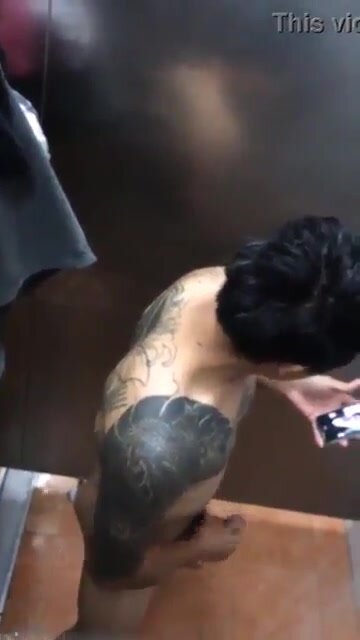 Spying on a tatt'd up hot Asian boy jacking off