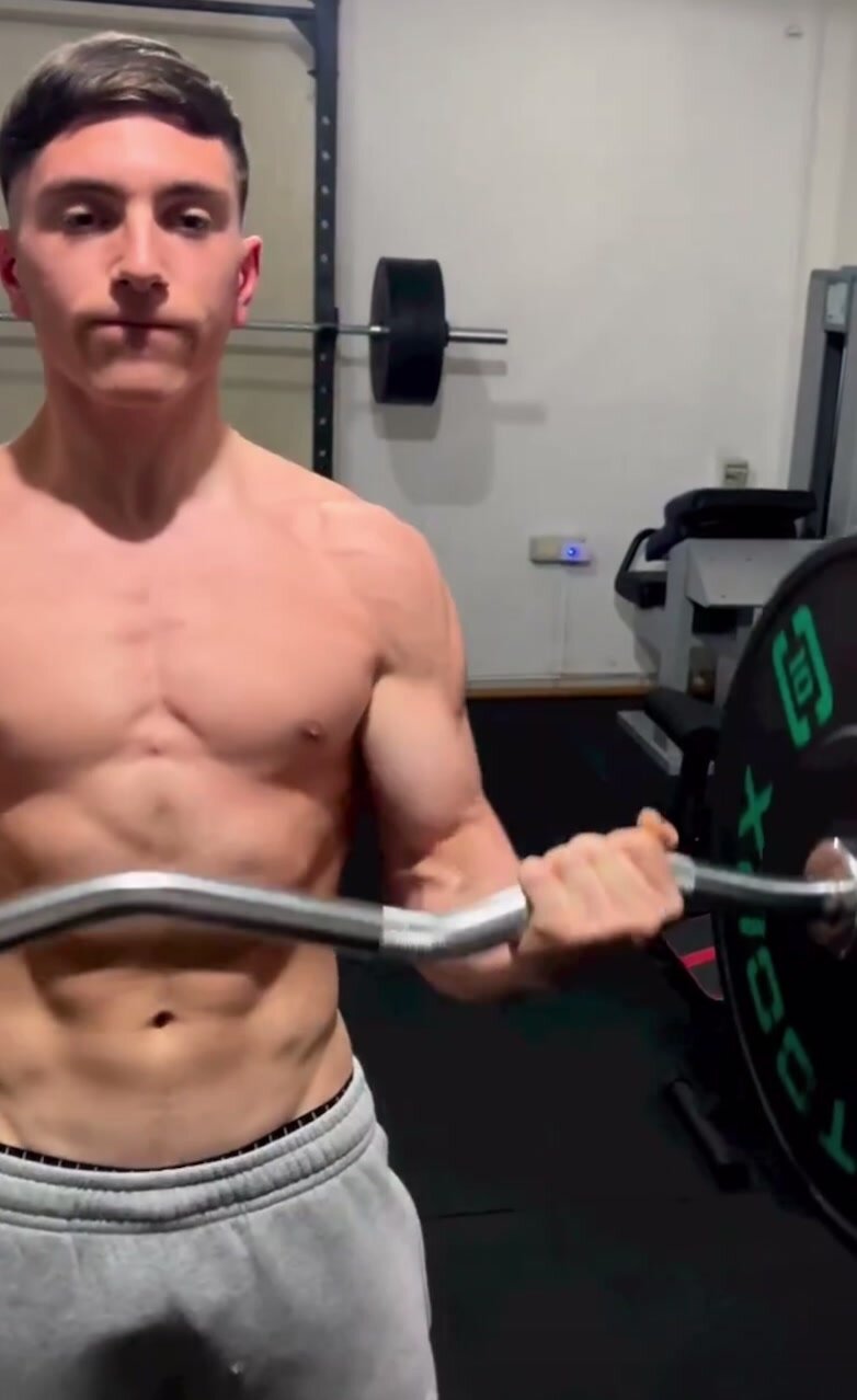 Italian sexy young man doing arms workout