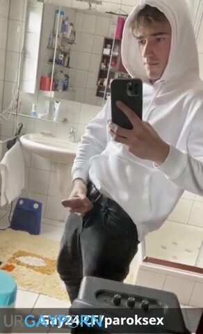 young twink in white hoodie has a wank in bathroom