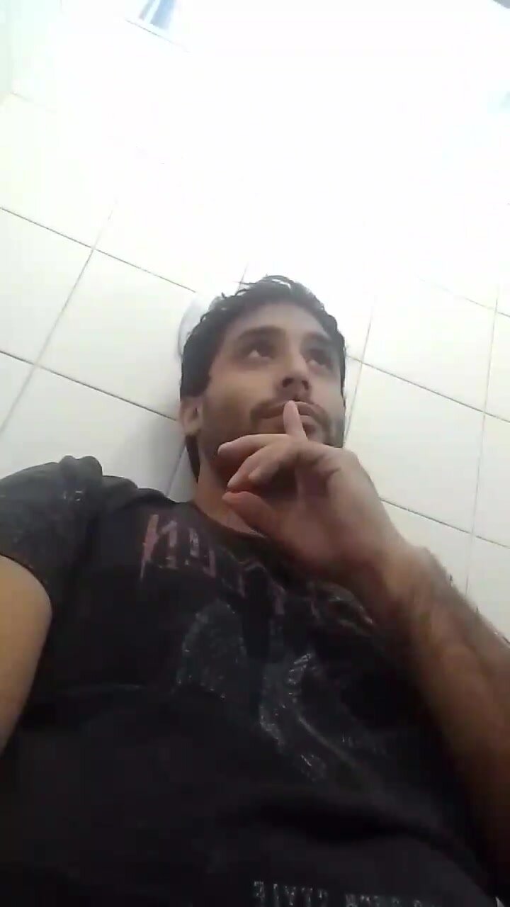 Handsome guy jerks in public toilet