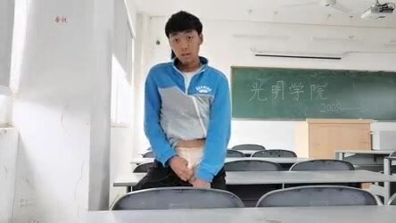 Asian guy jerking in class