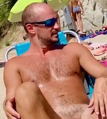 Handsome dad nude on the beach