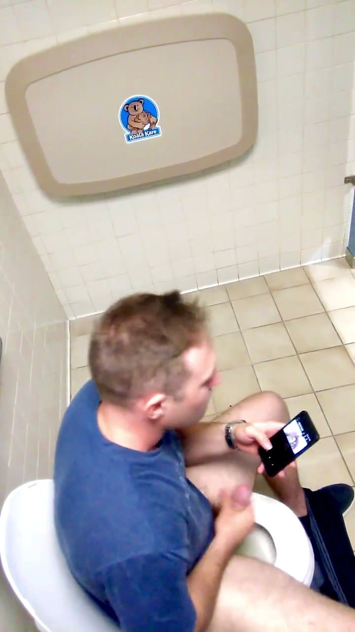 Bushy guy caught jerking in stall