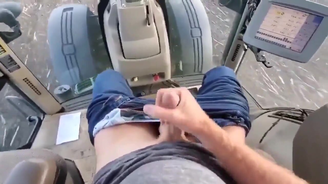 Country boy jerking off while driving tractor