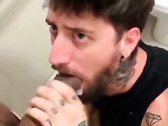 Tattooed fag begs for cum in bathroom stall