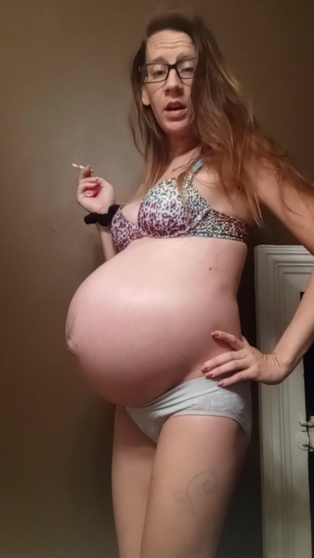 Pregnant smoking with big belly