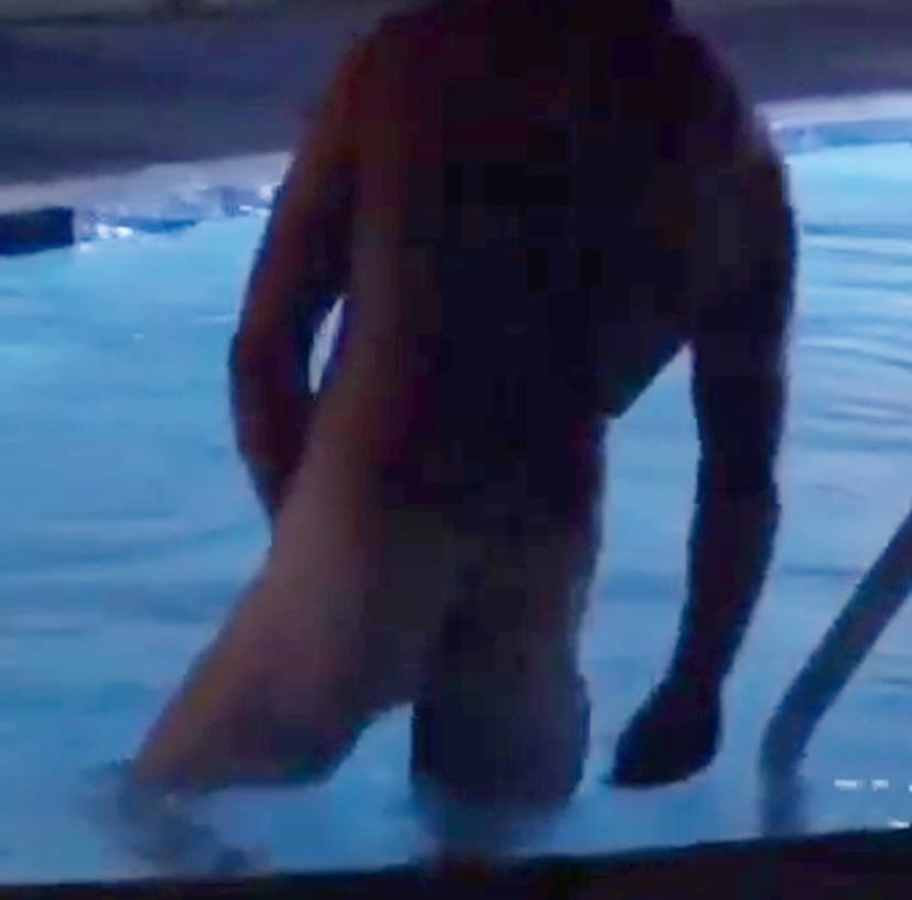 Gay couple skinny dips in motel pool