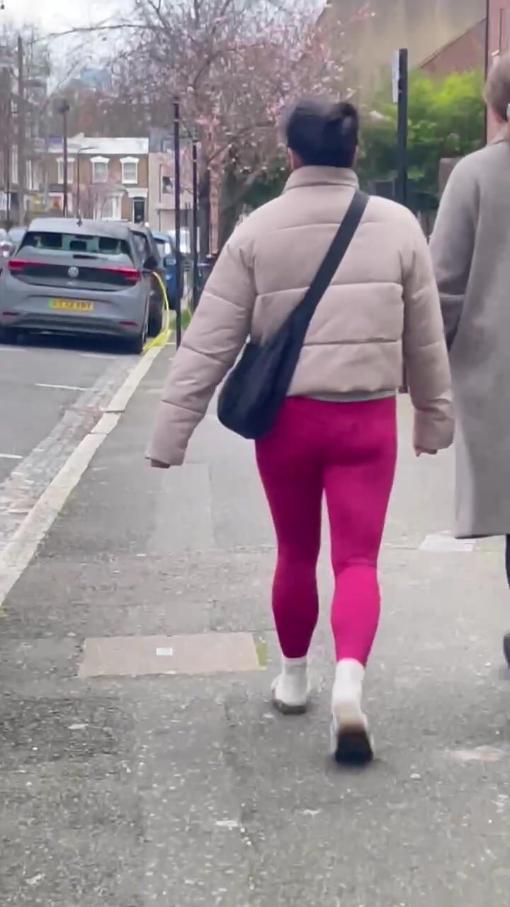 Petite Asian woman in pink yoga pants