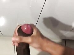 Huge brown uncut cock is jerked and spurts hot cumload