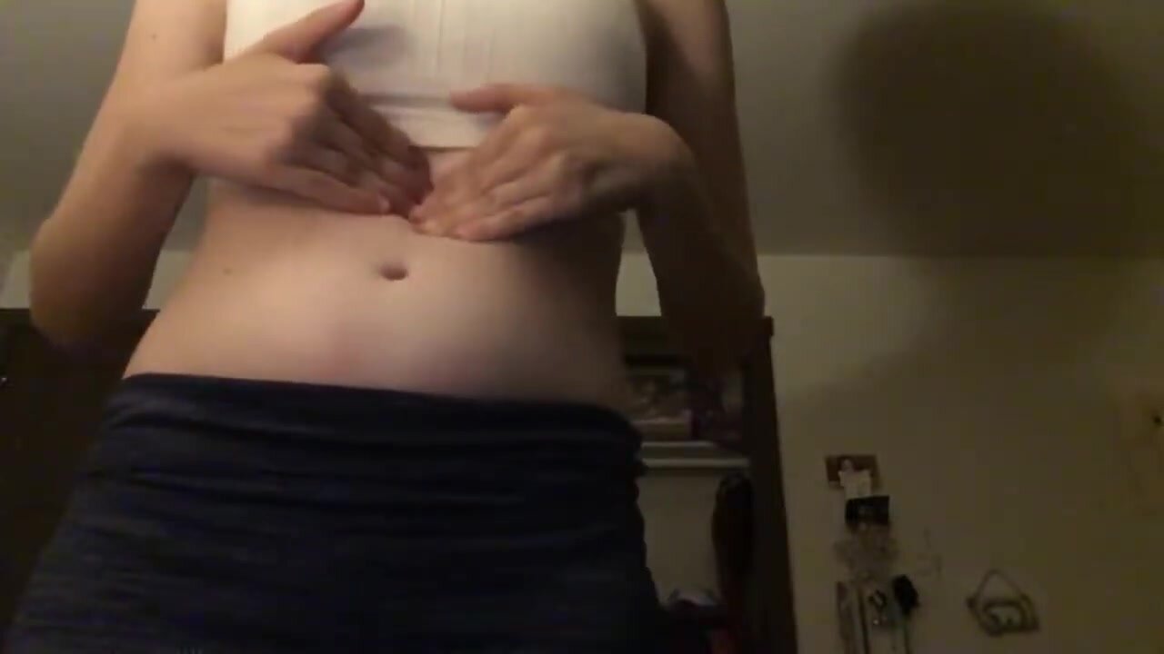 Slim bloated girl belly play
