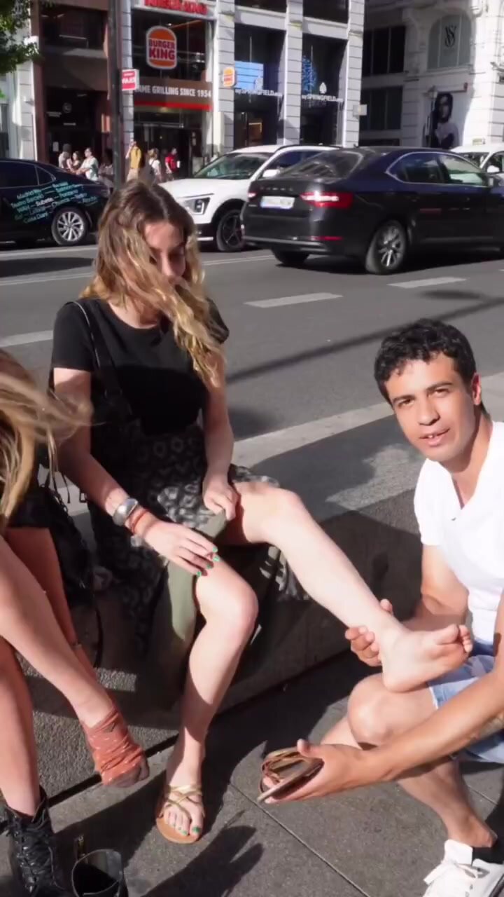 Spanish speaking slave licks a girls feet in public
