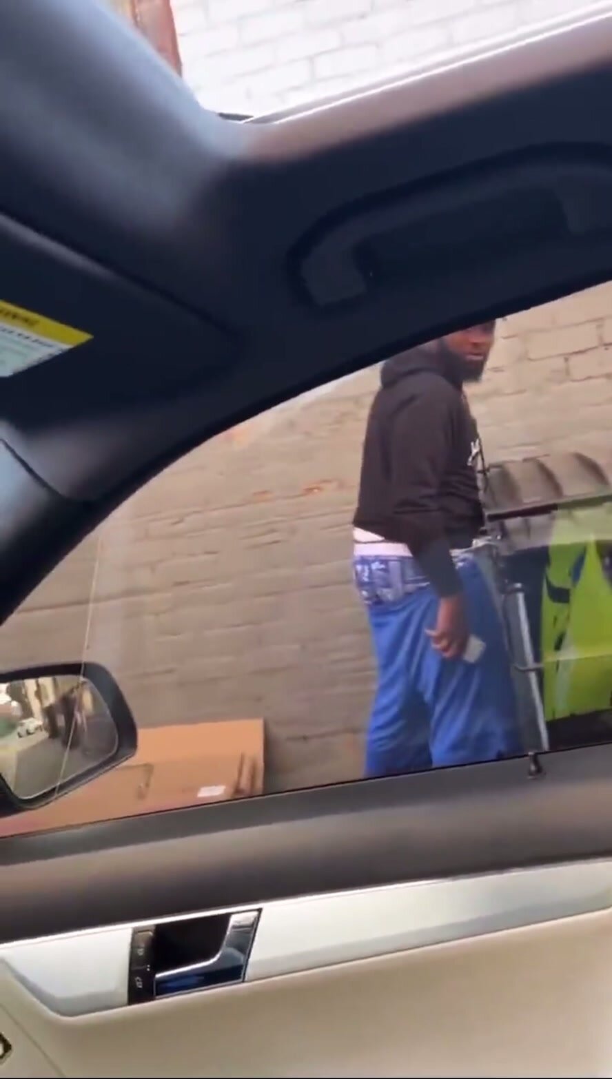 Black guy caught pissing on the street