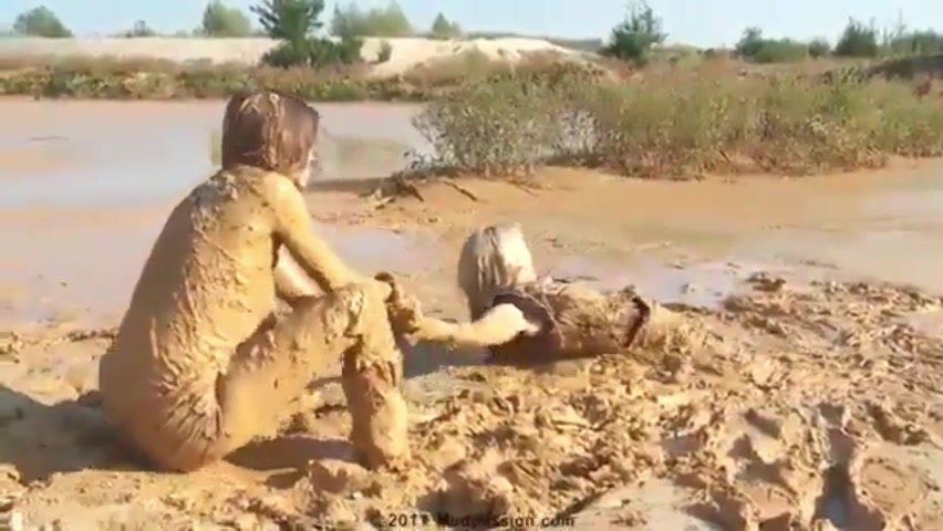 two girls stuck in mud and...
