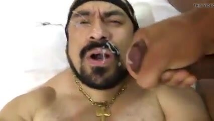 Bearded macho gets a load on his face