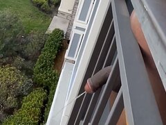 Pissing off the balcony - video 2