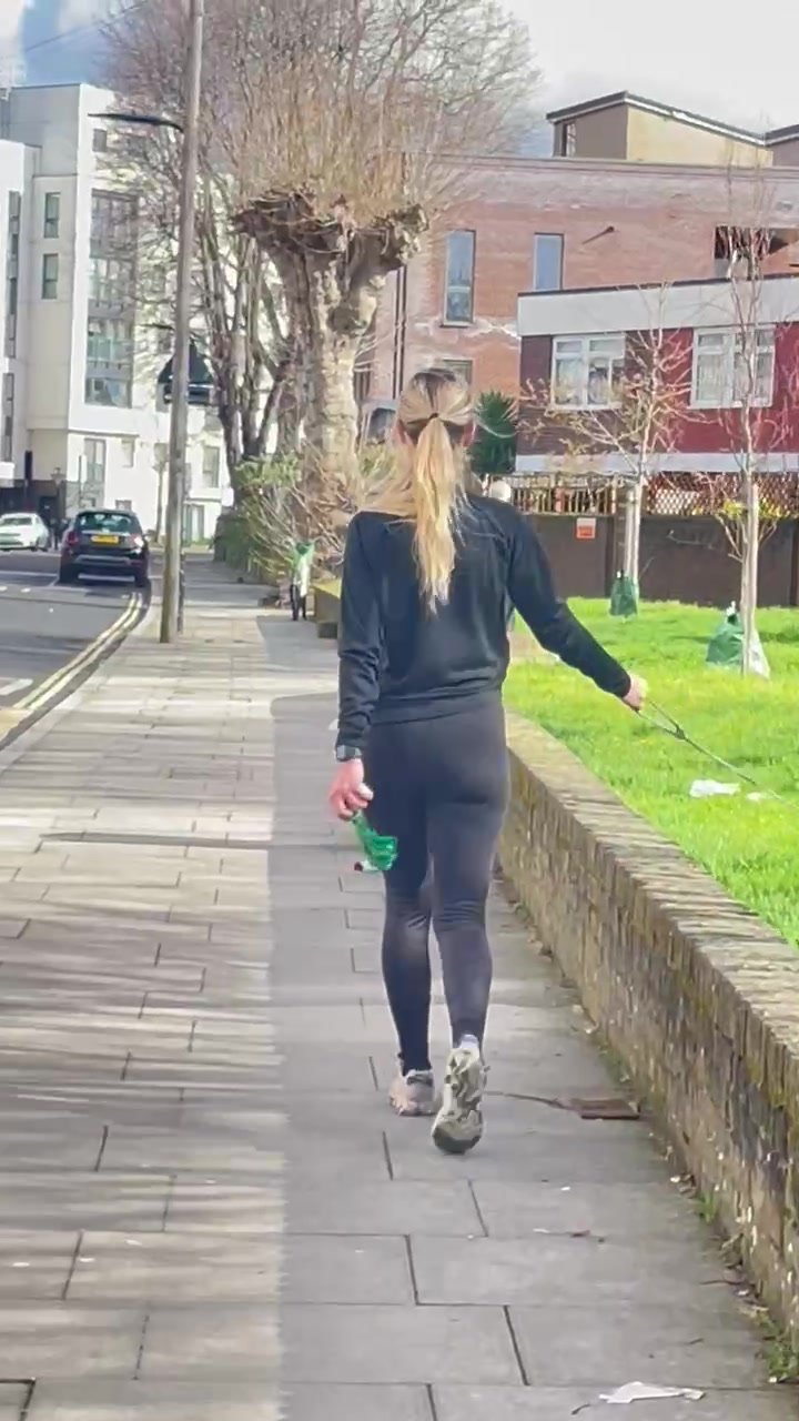 Sexy blonde walking the dog