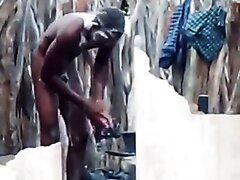 hung african dude caught bathing naked outdoors